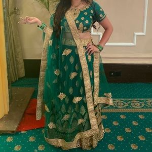 Heavy bridal Lengha. Green with gold work all over
